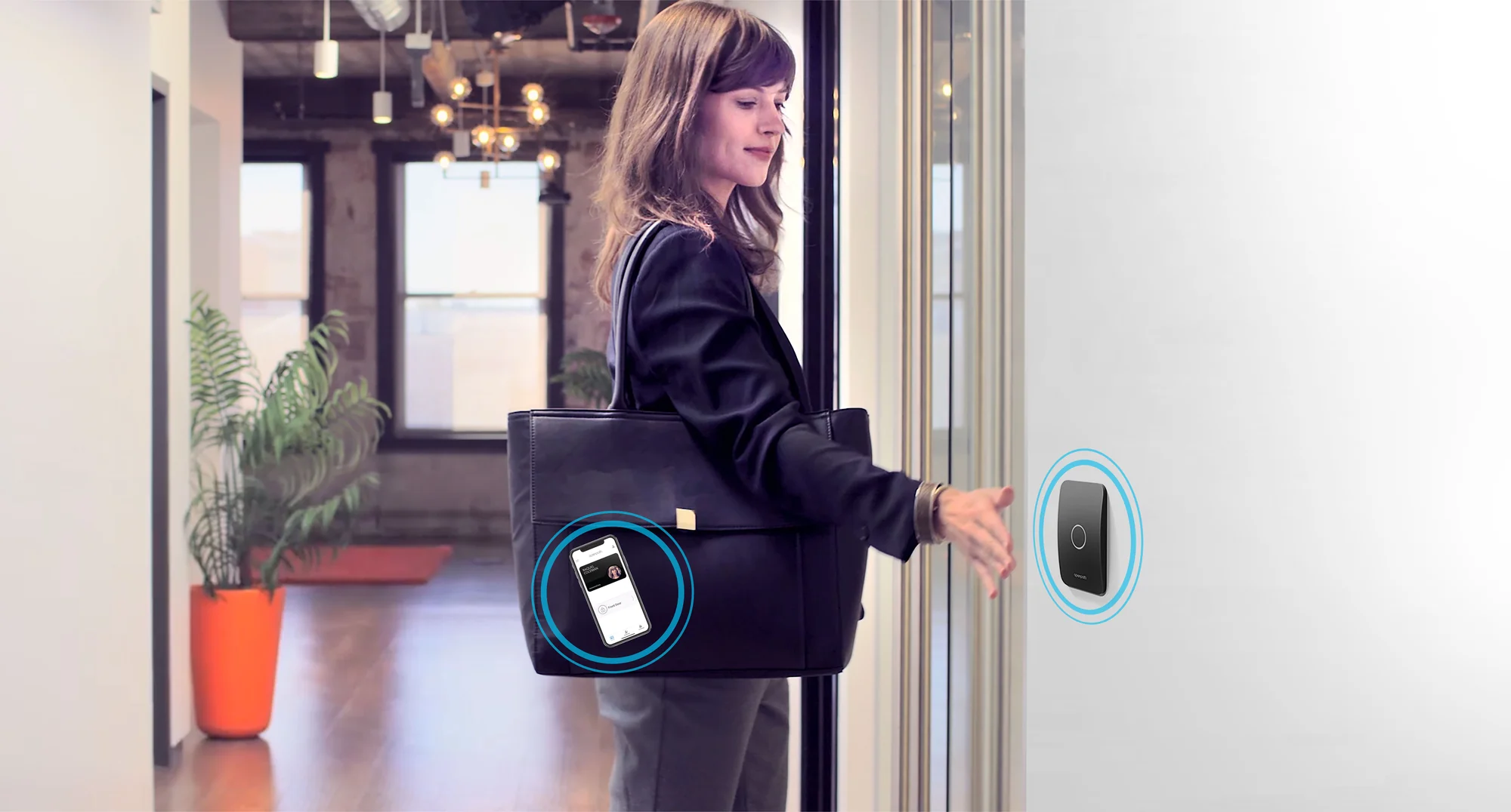 A reader on every door. The phone is the badge; a lost one is turned off in seconds.