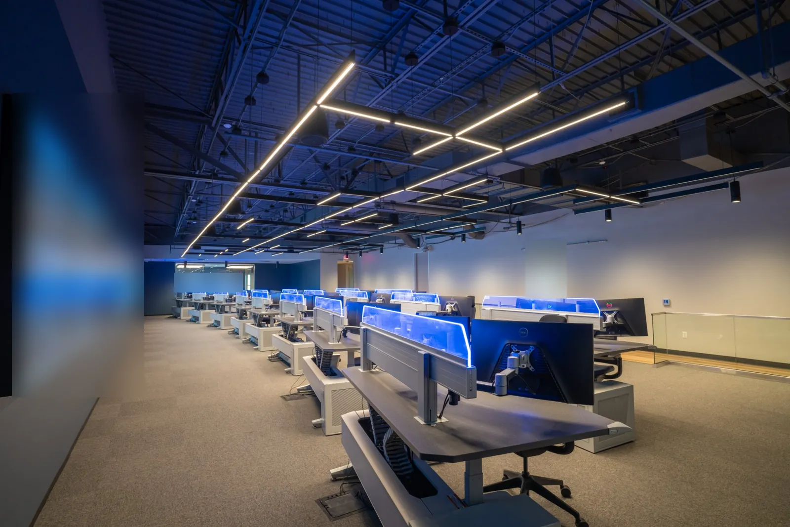 GSOC operations floor with operator consoles facing a full-length video wall